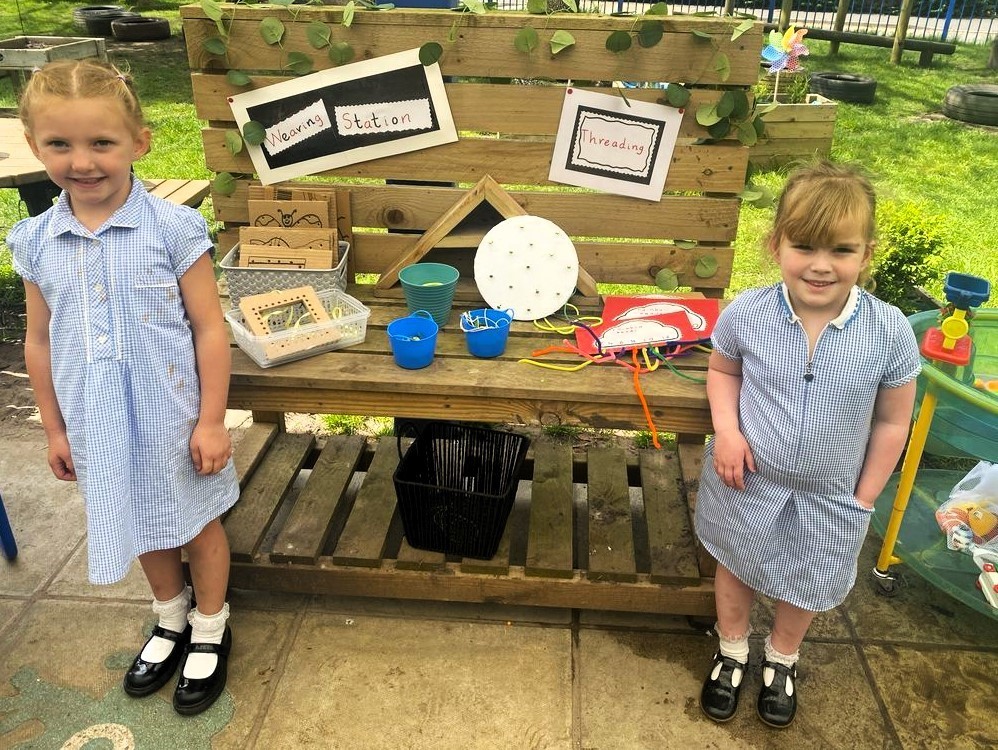 Pupils with new outdoor creations at The Rofft School.