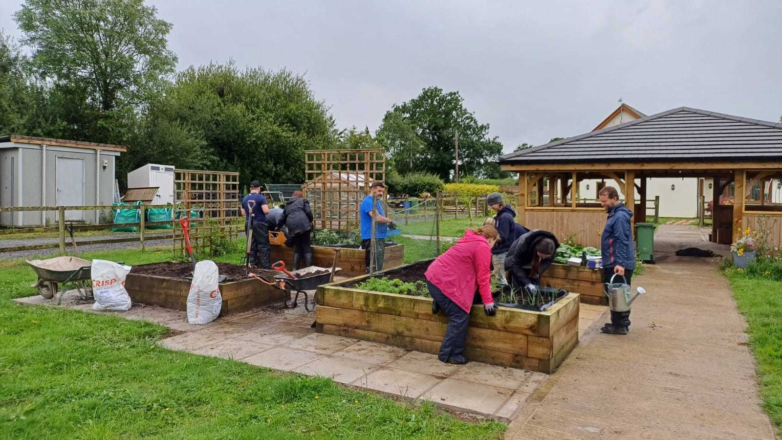 Working on raised beds at Agri-cation CIC.