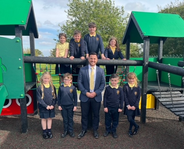 Ysgol y Llan new headteacher Tomos Williams, with some of the pupils.