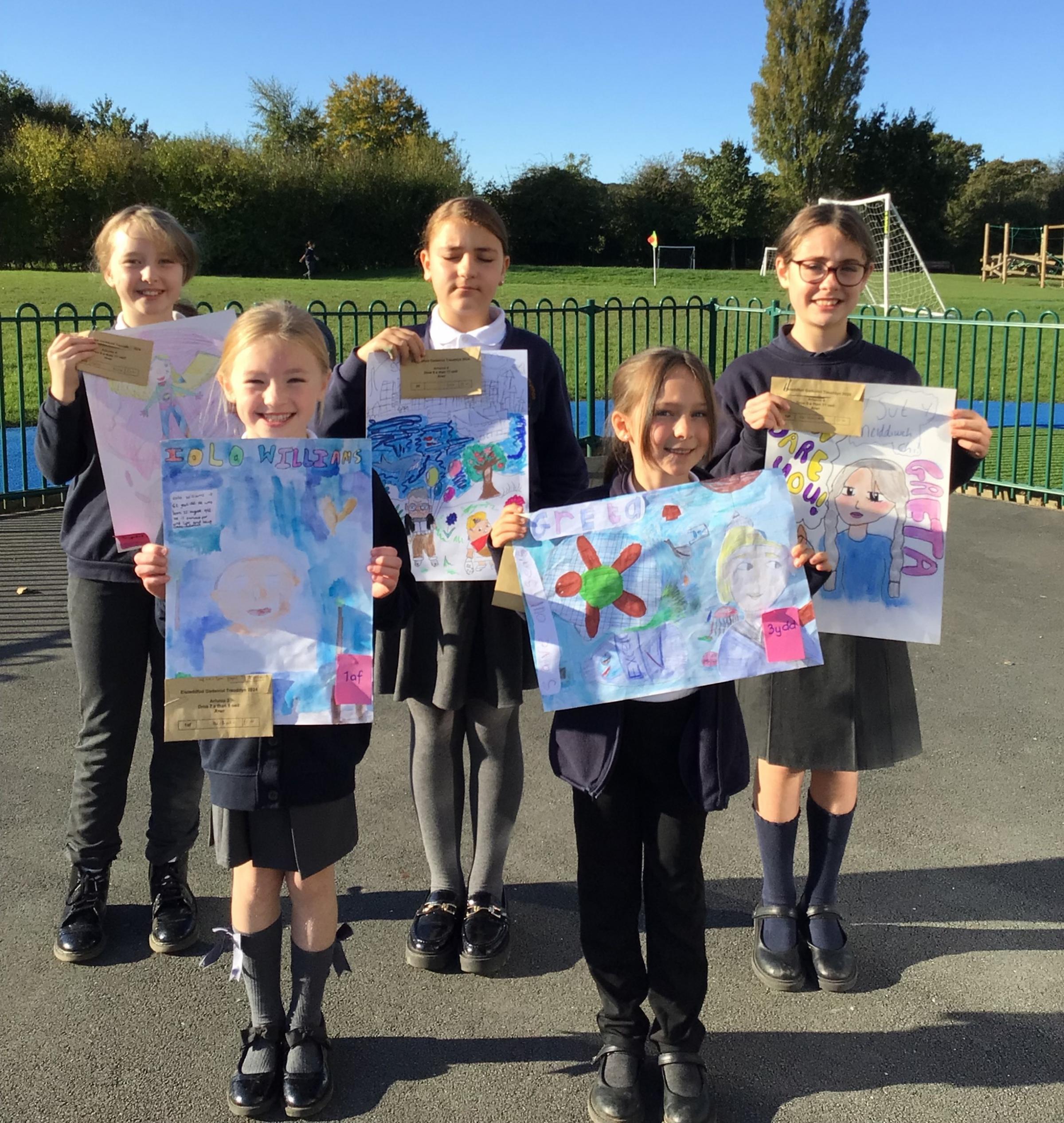 Ysgol Ty Ffynnon pupils with their eisteddfod artwork.