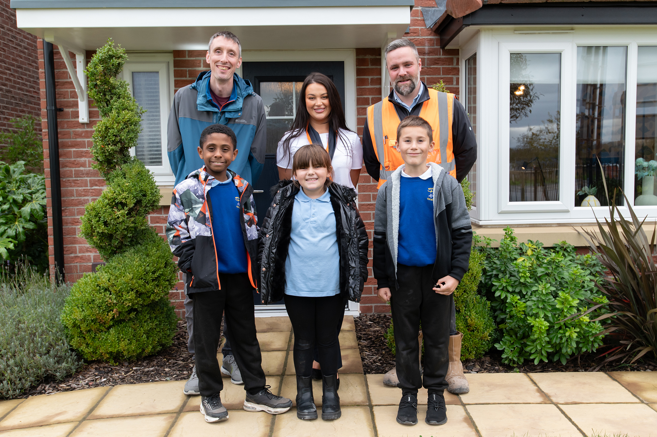 Robin Davies, Hannah Roberts and Guy Charalambous, with pupils Manoah, Elsie and Leon.