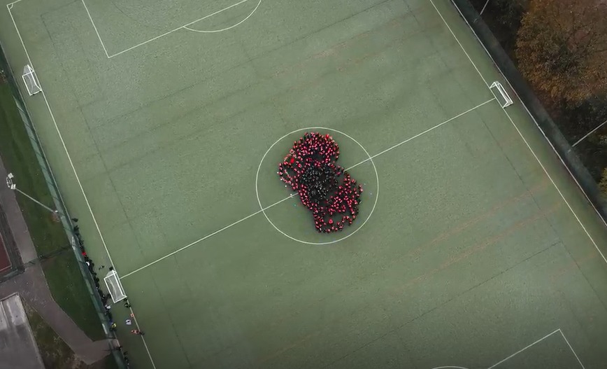 About 200 pupils at Elfed High School created a giant poppy.