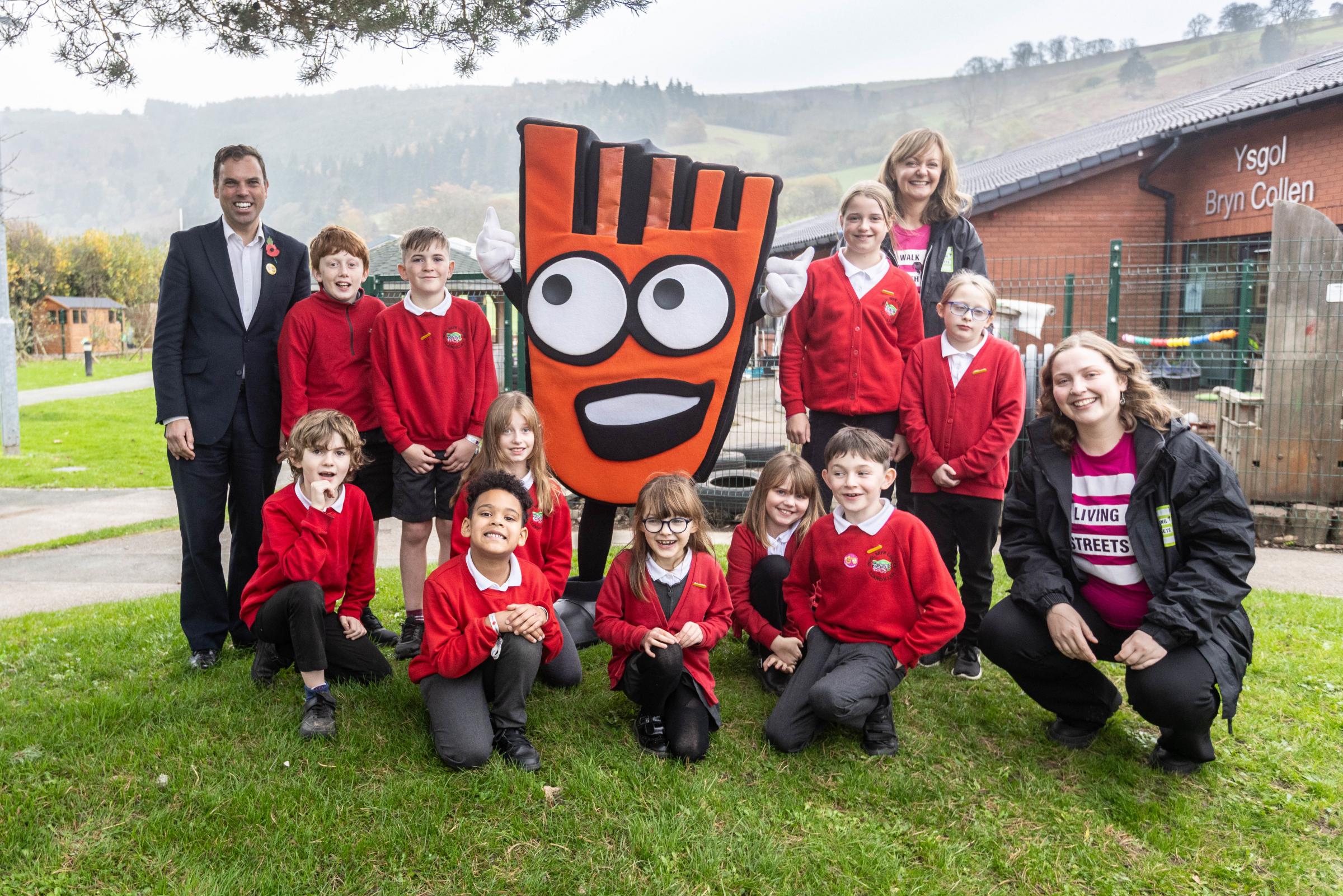 Ken Skates MS with pupils from Ysgol Bryn Collen and Living Streets staff and mascot Strider.