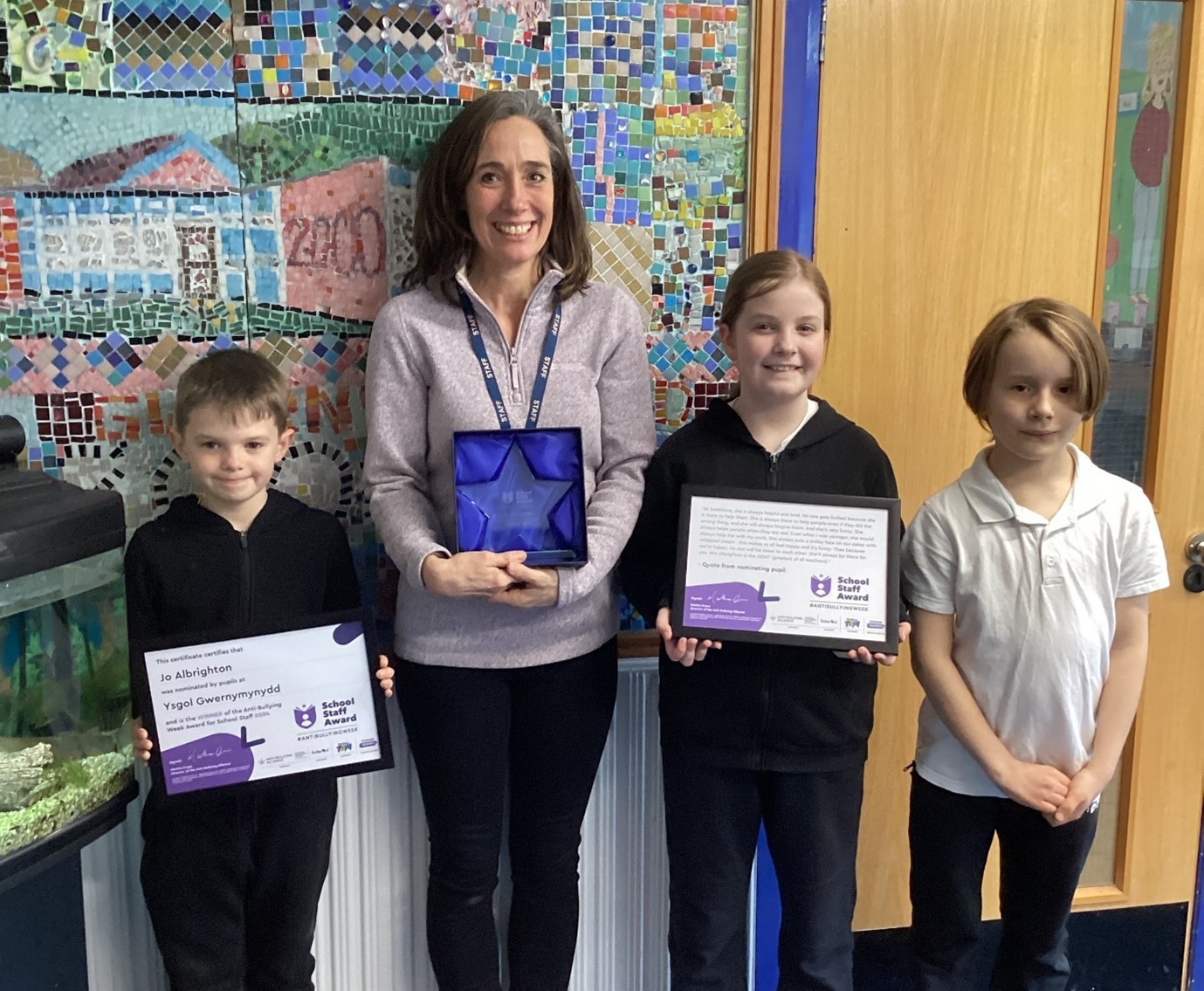 Anti-Bullying Week 2024 School Staff Award winner, teaching assistant Jo Albrighton, with pupils at Gwernymynydd CP School.