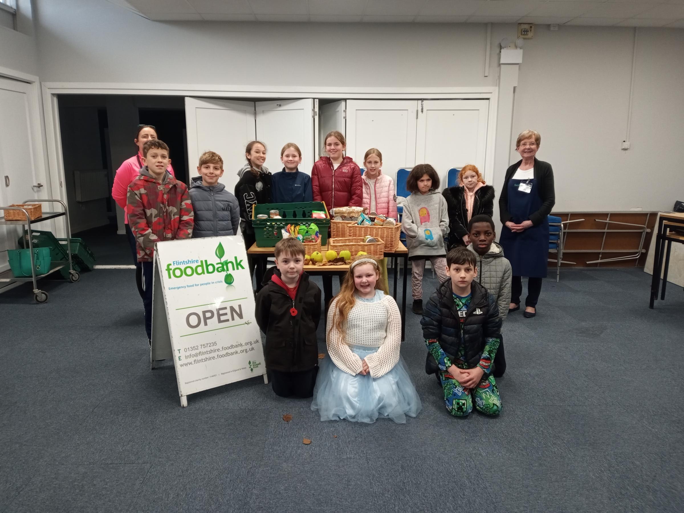 Mini Vinnies from St Davids School, with foodbank volunteers Kate Welsh and Sandra Dickson.