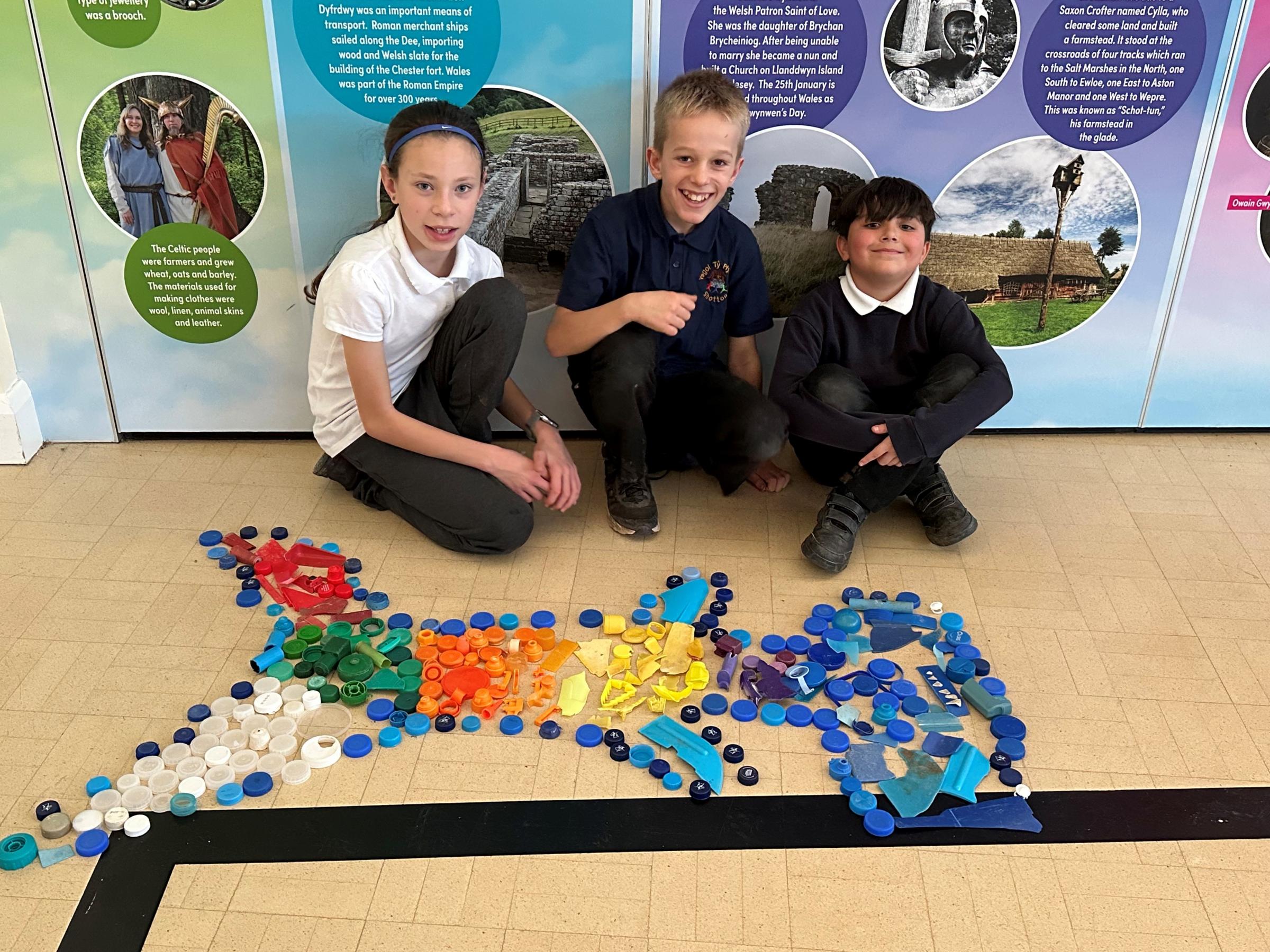 Ysgol Ty Ffynnon pupils with their envirinmental artwork.