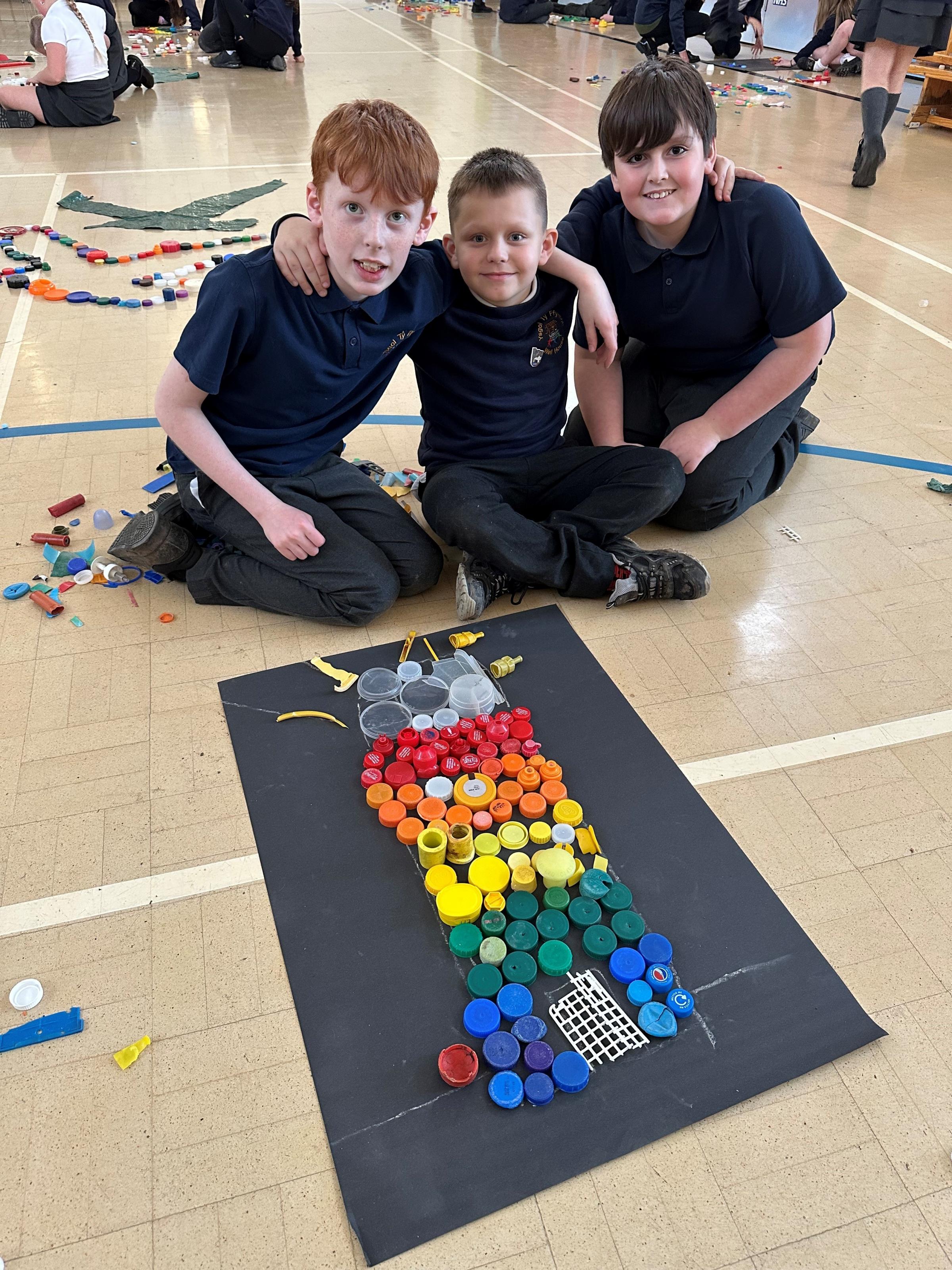 Ysgol Ty Ffynnon pupils with their envirinmental artwork.